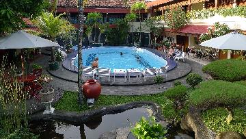 ENJOYING THE SWIMMING POOL